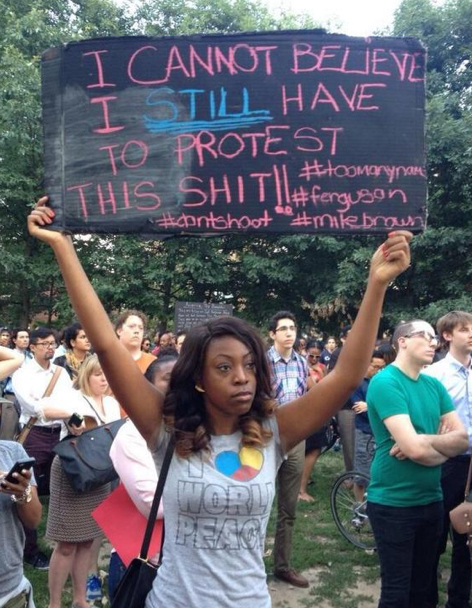 Figure 5: ‘I Cannot Believe I STILL have to Protest this Shit’ Sign, with Hashtags. (Starr, 2014). 